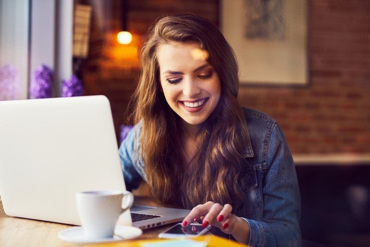 Woman reading about tips on using her digital wallet.