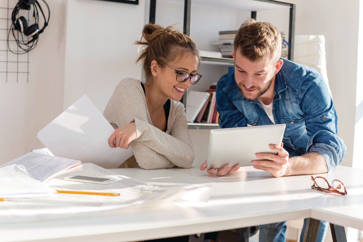 Couple reading Financial tips for Starting a New Business