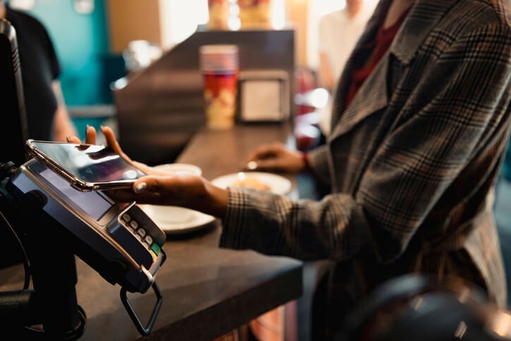 Woman reading about tips on using her digital wallet