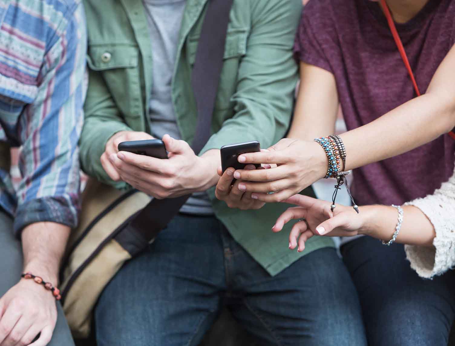 Young adults with mobile phones